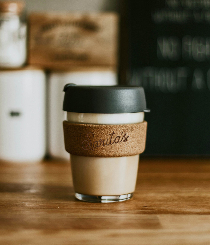 Sarita's branded reusable coffee cup.