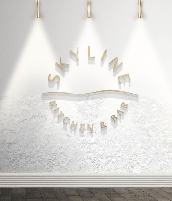 Etched metal signage with a textural wall horizon.
