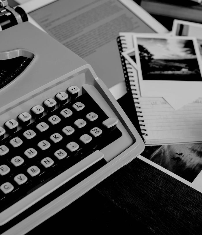 Black & white photograph of a typewriter and other ephemera 